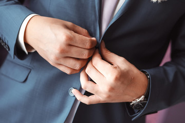 Man arranging his buttonholes
