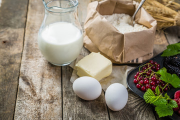 Baking concept - ingredients on rustic wood background