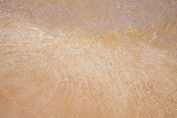 Yellow warm sand and summer sea. Summer beach background.