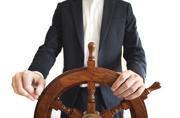 Hand on ship rudder. Businessman holding ship rudder.