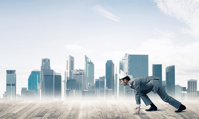 King businessman in elegant suit running and modern cityscape at