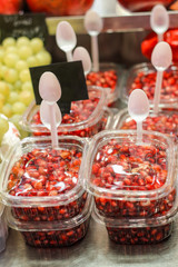 Pomegranate seeds in jars on store shelves
