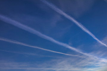 Beautiful sky, clouds and stripes from flying planes