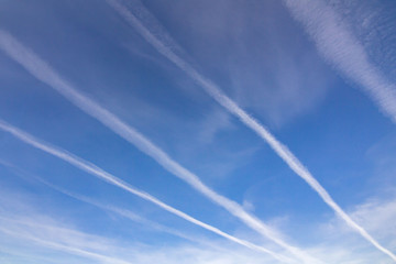 Beautiful sky, clouds and stripes from flying planes