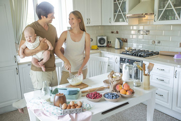 The family cooks in the kitchen 