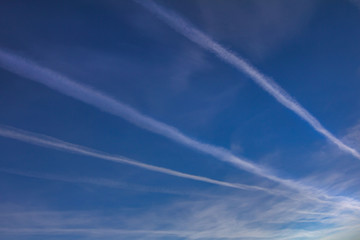 Naklejka na ściany i meble Beautiful sky, clouds and stripes from flying planes