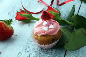 Delicious cupcake for Valentine Day. cake for Valentines day with chocolate and strawberries. Traditional homemade with red roses