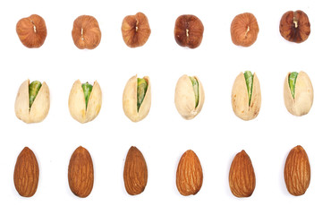 Mix nuts almonds, hazelnuts pistachios isolated on white background. Top view. Flat lay