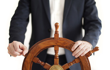 Hand on ship rudder. Businessman holding ship rudder.