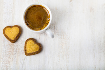 Heart-shaped biscuits and coffee