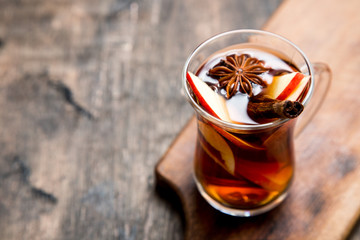 hot spicy beverage. Hot drink (apple tea, punch) with cinnamon stick and star anise. Seasonal mulled drink