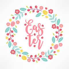 Easter wreath with berries, eggs, flowers, leaves and branches