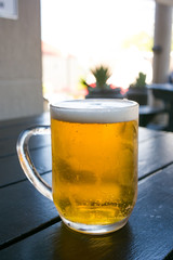 Close up image of a jug of cold beer at a restaurant