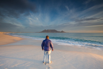 Beautiful wide angle landscape image of Table Mountain in Cape Town South Africa as seen from Blouberg beach