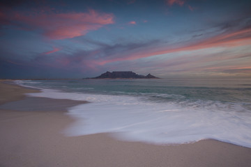 Beautiful wide angle landscape image of Table Mountain in Cape Town South Africa as seen from Blouberg beach