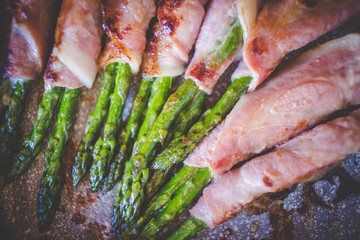 Close up view of asparagus wrapped in beacon