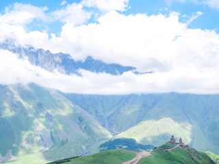 beautiful landscape with mountains and Holy Trinity Church in Georgia