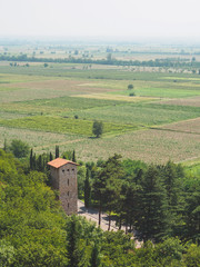 aerial view of old stone tower and green fields in Georgia