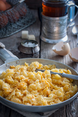 Pasta cooked with egg in a frying pan, rustic style, selective focus