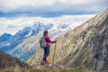 Fototapeta premium Young woman on the top of mountains