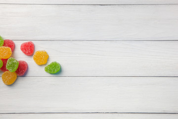 Marmalade green, yellow and red on a light wooden background
