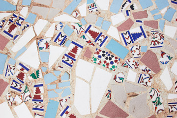 Wall with broken ceramic colored fragments