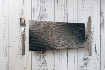 Japanese Plate with fork and knife on white wooden background
