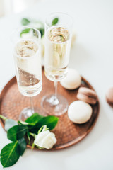 Luxurious champagne wedding party with white roses and macaron d