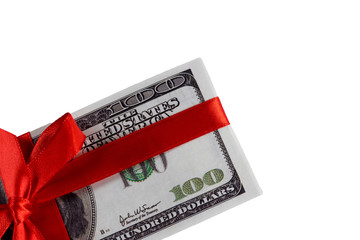 Bundle of bills of one hundred dollars tied with a red ribbon. Dollars isolated on white background.