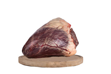 Beef heart cut in half on a cutting Board. isolate on white background. copy paste