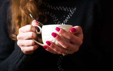 Female holding a cup of tea