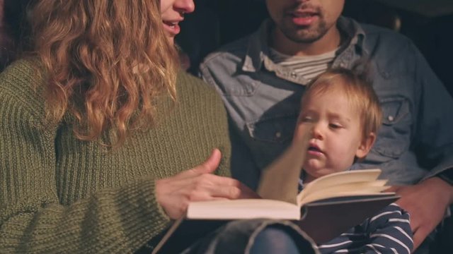 PArents reading to their child