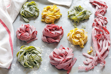 Homemade green, red and yellow pasta.