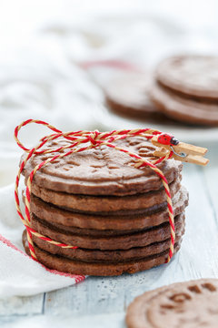Stack of chocolate cookies tied with a cord.