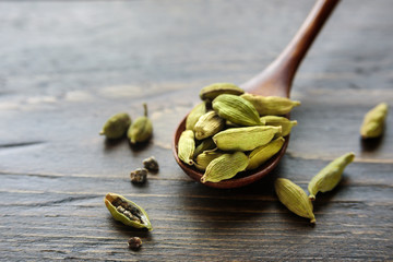 Spoon with cardamom seeds