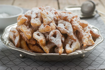 Angel wings biscuits, a traditional European sweet dish for carnival. Rustic style.