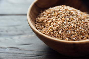 Bowl with bulgur. Uncooked