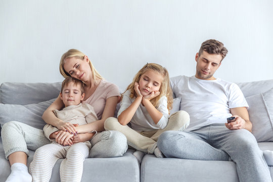 bored family fell a sleep while watching movie at home on weekend