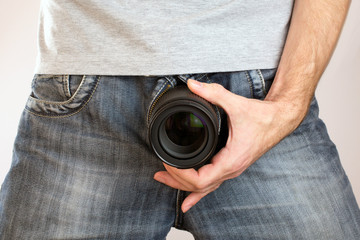 camera lens out of jeans like mens penis. Potency sexual problems and pornography concept. Man with...