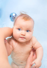Six month old baby bathing