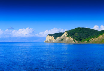 Beautiful summertime panoramic seascape. View of the crystal clear azure sea bay and limestone cliffs. Agios Stefanos cape. Ag. Stefanos. Corfu. Greece.