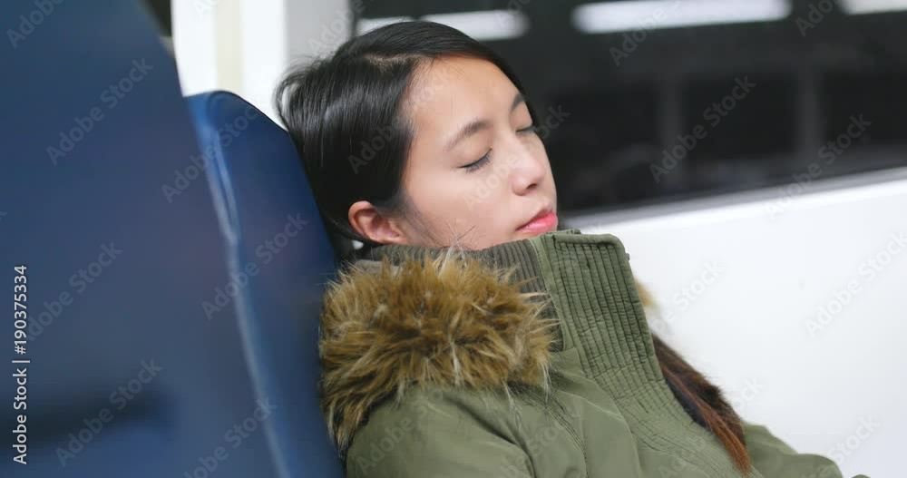 Wall mural woman sleeping on the ferry