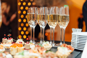 Wedding glasses filled with champagne at banquet