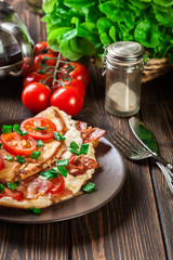 Omelette with bacon and tomatoes