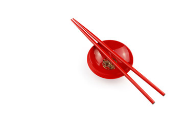 red Chopsticks on Red bowl for sushi on White background Copy space