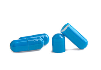three blue capsule open medicine isolated on white background