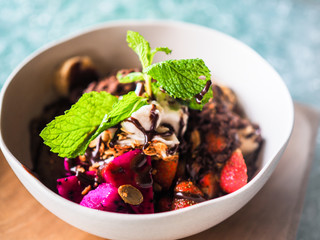 fresh granola breakfast bowl with strawberry