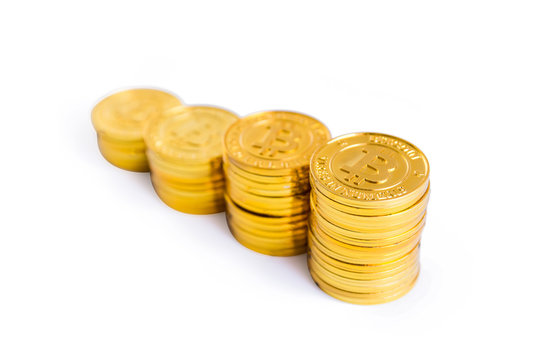 Golden bitcoin coins stack. Isolated on white background with clipping path