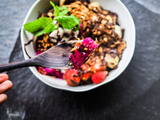 fresh granola breakfast bowl with strawberry