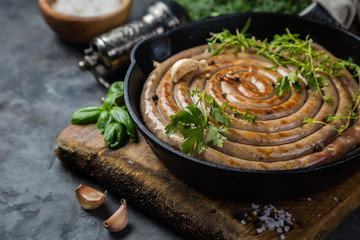 Barbeque sausages on cast iron pan